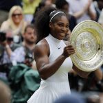 
              FILE - Serena Williams of the U.S holds her trophy after winning the women's singles final against Angelique Kerber of Germany on day thirteen of the Wimbledon Tennis Championships in London, Saturday, July 9, 2016. Serena Williams is going to play at Wimbledon this year, after all. The All England Club announced via Twitter on Tuesday, June 14, 2022, that Williams was awarded a wild-card entry for singles.(AP Photo/Ben Curtis, File)
            