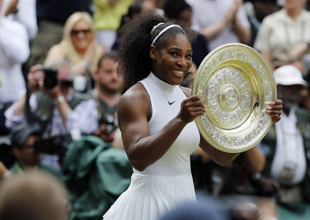 FILE - Serena Williams of the U.S holds her trophy after winning the women's singles final against ...