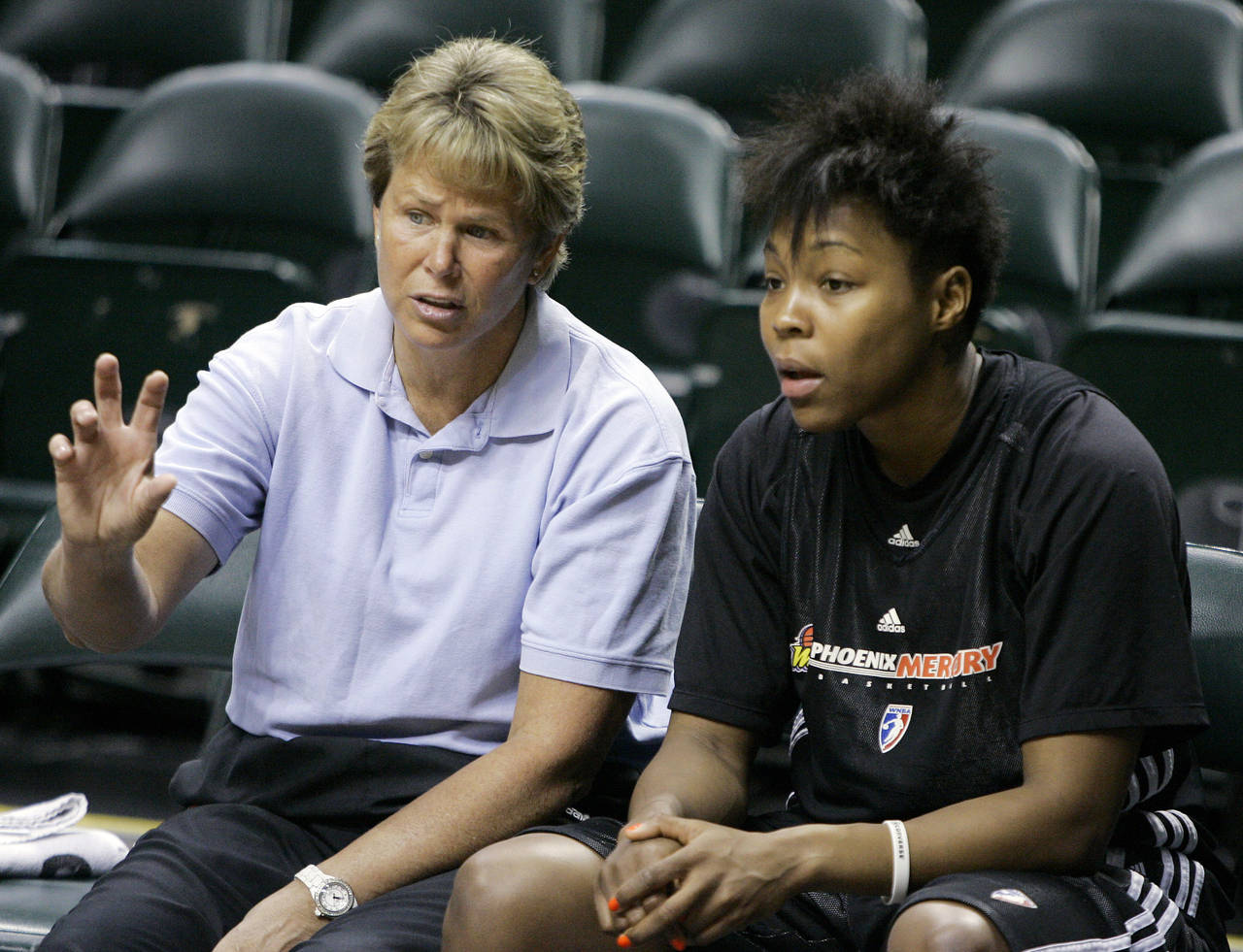 FILE - Phoenix Mercury general manager Ann Meyers Drysdale, left, talks with forward Cappie Pondext...