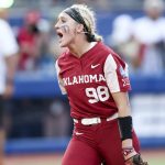 
              Oklahoma pitcher Jordyn Bahl (98) yells after striking out a Texas batter to end an inning during the second game of the NCAA softball Women's College World Series finals in Oklahoma City, Okla., Thursday, June 9, 2022. (Ian Maule/Tulsa World via AP)
            