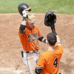 
              Oklahoma State utility Roc Riggio, left, celebrates with utility Zach Ehrhard (4) after hitting a home run against Missouri State during an NCAA college baseball tournament regional game Sunday, June 5, 2022, in Stillwater, Okla. (Ian Maule/Tulsa World via AP)
            