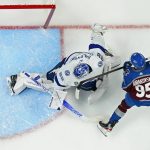 
              Colorado Avalanche left wing Andre Burakovsky (95) scores on Tampa Bay Lightning goaltender Andrei Vasilevskiy (88) during the first period in Game 2 of the NHL hockey Stanley Cup Final, Saturday, June 18, 2022, in Denver. (AP Photo/John Locher)
            