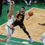 
              Golden State Warriors guard Stephen Curry (30) passes the ball against Boston Celtics forward Grant Williams (12) during the third quarter of Game 4 of basketball's NBA Finals, Friday, June 10, 2022, in Boston. (AP Photo/Michael Dwyer)
            