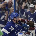 
              Tampa Bay Lightning center Ross Colton (79) and Colorado Avalanche right wing Logan O'Connor (25) fight during the third period of Game 3 of the NHL hockey Stanley Cup Final on Monday, June 20, 2022, in Tampa, Fla. (AP Photo/Phelan M. Ebenhack)
            