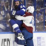 
              Tampa Bay Lightning defenseman Zach Bogosian (24) is checked by Colorado Avalanche center Darren Helm (43) during the second period of Game 6 of the NHL hockey Stanley Cup Finals on Sunday, June 26, 2022, in Tampa, Fla. (AP Photo/Phelan Ebenhack)
            