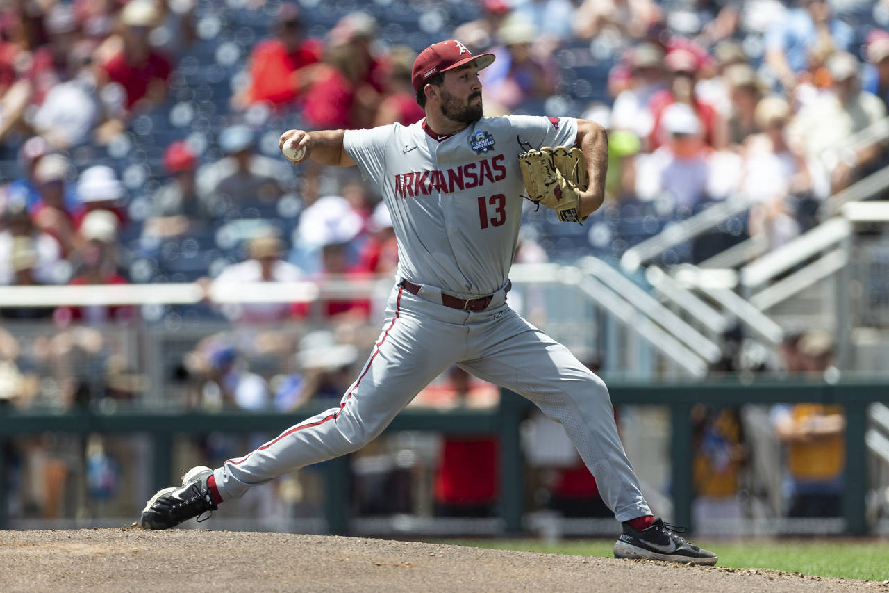 Arkansas starting pitcher Connor Noland (13) throws a pitch against Stanford in the first inning du...
