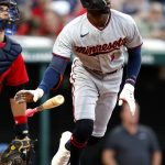 
              Minnesota Twins' Nick Gordon, right, watches his two-run home run against the Cleveland Guardians during the sixth inning of a baseball game Monday, June 27, 2022, in Cleveland. (AP Photo/Ron Schwane)
            