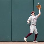 
              Texas A&M outfielder Jordan Thompson (31) catches a ball on the warning track for an out against Louisville during an NCAA college baseball super regional tournament game Saturday, June 11, 2022, in College Station, Texas. (AP Photo/Sam Craft)
            