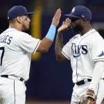 
              Tampa Bay Rays' Isaac Paredes (17) celebrates with Randy Arozarena after the team defeated the New York Yankees during a baseball game Tuesday, June 21, 2022, in St. Petersburg, Fla. (AP Photo/Chris O'Meara)
            