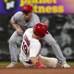 
              St. Louis Cardinals' Tommy Edman (19) steals second as the throw gets past Cincinnati Reds third baseman Brandon Drury during the seventh inning of a baseball game Friday, June 10, 2022, in St. Louis. (AP Photo/Jeff Roberson)
            