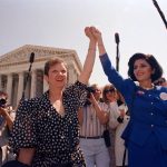 
              FILE - Norma McCorvey, Jane Roe in the 1973 court case, left, and her attorney Gloria Allred hold hands as they leave the Supreme Court building in Washington, DC., Wednesday, April 26, 1989. . (AP Photo/J. Scott Applewhite, File)
            