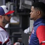 
              Chicago White Sox pitching coach Ethan Katz, left, talks with relief pitcher Reynaldo Lopez in the dugout during the first inning of a baseball game against the Texas Rangers in Chicago, Sunday, June 12, 2022. (AP Photo/Nam Y. Huh)
            