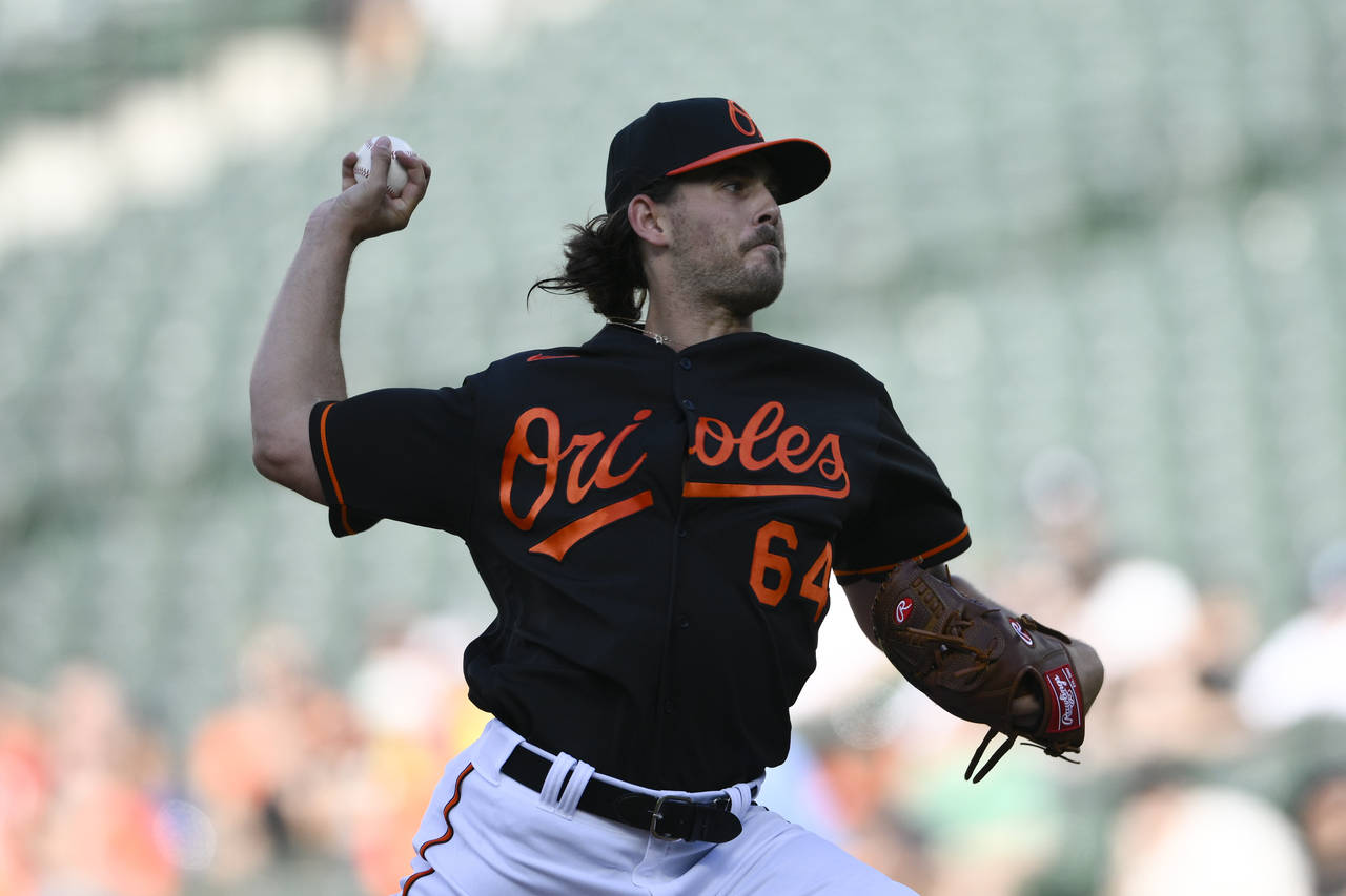 Baltimore Orioles starting pitcher Dean Kremer throws during the first inning of the team's basebal...