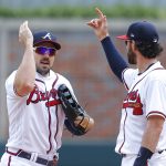 
              Atlanta Braves center fielder Adam Duvall,left, reacts with shortstop Dansby Swanson after their 7-6 victory over the San Francisco Giants in a baseball game, Thursday, June 23, 2022, in Atlanta. (AP Photo/Todd Kirkland)
            