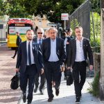 
              The former president of the the European Football Association (UEFA), Michel Platini, front center, arrives at the Swiss Federal Criminal Court in Bellinzona, Switzerland, Wednesday, June 8, 2022. Platini and the former president of the World Football Association (Fifa), Joseph Blatter, will stand trial before the Federal Criminal Court from Wednesday, over a suspicious two-million payment. (Alessandro Crinari/Keystone via AP)
            