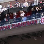 
              Former Washington Nationals player Ryan Zimmerman's name and jersey number is unveiled on the upper deck at his jersey retirement ceremony before a baseball game between the Nationals and the Philadelphia Phillies, Saturday, June 18, 2022, in Washington. (AP Photo/Nick Wass)
            