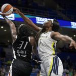 
              Phoenix Mercury center Tina Charles (31) has her shot blocked by Dallas Wings center Teaira McCowan (7) in the second half of a WNBA basketball game, Friday, June 17, 2022, in Arlington, Texas. (AP Photo/Tony Gutierrez)
            