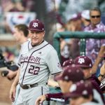 
              Texas A&M baseball coach Jim Schlossnagle speaks with his staff before they face TCU in  an NCAA college baseball tournament regional game Sunday, June 5, 2022, in College Station, Texas. (Meredith Seaver/College Station Eagle via AP)
            