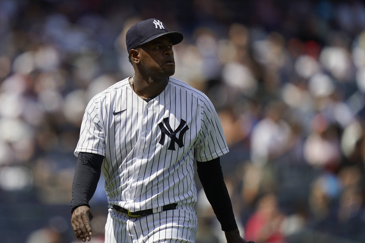New York Yankees starting pitcher Luis Severino (40) walks back to the dugout during the change in ...