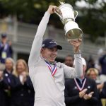 
              Matthew Fitzpatrick, of England, celebrates with the trophy after winning the U.S. Open golf tournament at The Country Club, Sunday, June 19, 2022, in Brookline, Mass. (AP Photo/Charles Krupa)
            