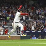 
              Atlanta Braves second baseman Orlando Arcia gets some air and the fans go wild as he hits a walk off single to beat the San Francisco Giants 2-1 during the ninth inning of a baseball game on Monday, June 20, 2022, in Atlanta. (Curtis Compton/Atlanta Journal-Constitution via AP)
            