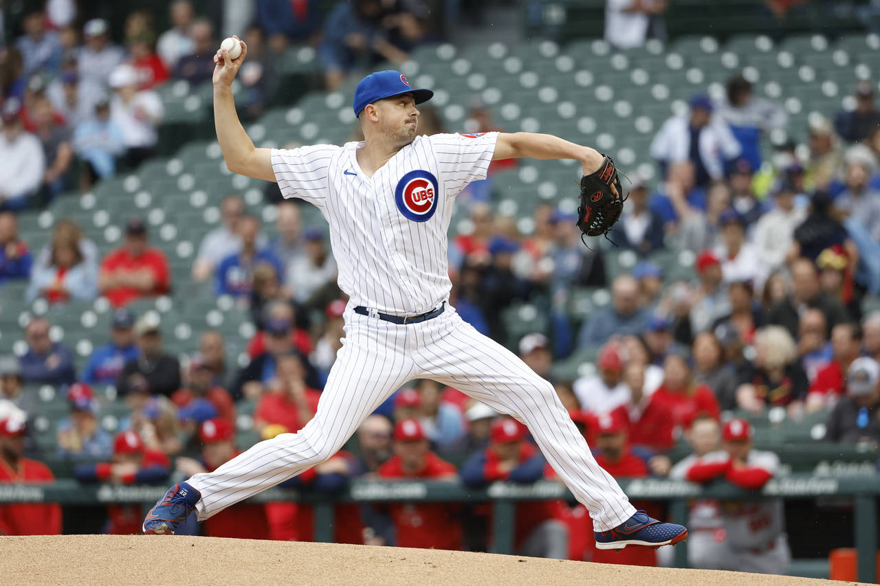 Chicago Cubs starting pitcher Matt Swarmer delivers against the St. Louis Cardinals during the firs...