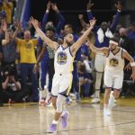 
              Golden State Warriors guard Stephen Curry (30) celebrates after guard Klay Thompson, right, shot a 3-point basket during the second half of Game 5 of basketball's NBA Finals against the Boston Celtics in San Francisco, Monday, June 13, 2022. (AP Photo/Jed Jacobsohn)
            