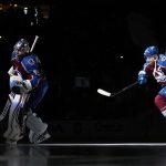 
              Colorado Avalanche goaltender Darcy Kuemper (35) and left wing Gabriel Landeskog (92) take the ice before Game 1 of the team's NHL hockey Stanley Cup playoffs Western Conference finals against the Edmonton Oilers on Tuesday, May 31, 2022, in Denver. (AP Photo/Jack Dempsey)
            