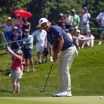 
              Xander Schauffele putts on the fourth hole during the third round of the Travelers Championship golf tournament at TPC River Highlands, Saturday, June 25, 2022, in Cromwell, Conn. (AP Photo/Seth Wenig)
            