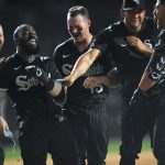 
              Chicago White Sox's Josh Harrison second from left, celebrates with teammates after hitting a walk-off RBI single to defeat the Toronto Blue Jays 7-6 in twelve innings of a baseball game Tuesday, June 21, 2022, in Chicago. (AP Photo/Paul Beaty)
            