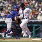 
              Detroit Tigers' Spencer Torkelson scores ahead of the throw to Texas Rangers catcher Sam Huff (55) in the fourth inning of a baseball game in Detroit, Saturday, June 18, 2022. (AP Photo/Paul Sancya)
            