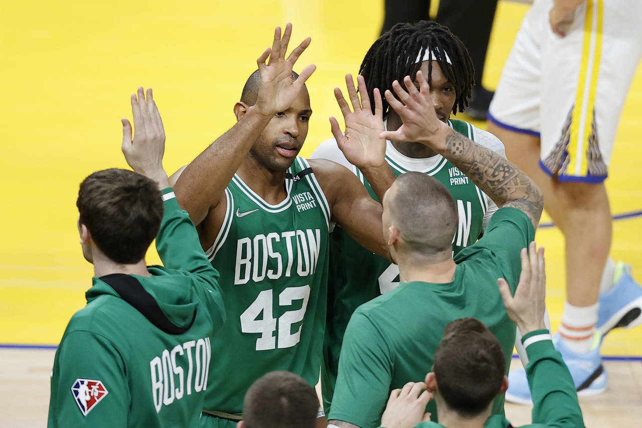 Boston Celtics center Al Horford (42) celebrates with teammates during the second half of Game 1 of...