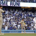 
              Los Angeles Dodgers' Justin Turner, right, rounds third after hitting a solo home run as San Diego Padres starting pitcher Joe Musgrove, left, watches along with third baseman Ha-Seong Kim during the second inning of a baseball game Thursday, June 30, 2022, in Los Angeles. (AP Photo/Mark J. Terrill)
            