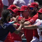 
              Seattle Mariners' J.P. Crawford, left, and several members of the Los Angeles Angels scuffle after Mariners' Jesse Winker was hit by a pitch during the second inning of a baseball game Sunday, June 26, 2022, in Anaheim, Calif. (AP Photo/Mark J. Terrill)
            