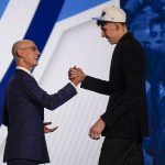 
              Chet Holmgren, right, is congratulated by NBA Commissioner Adam Silver after being selected second overall in the NBA basketball draft by the Oklahoma Thunder, Thursday, June 23, 2022, in New York. (AP Photo/John Minchillo)
            