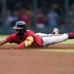 
              Atlanta Braves' Ronald Acuna Jr. slides into second base with a double in the first inning of the team's baseball game against the Pittsburgh Pirates on Friday, June 10, 2022, in Atlanta. (AP Photo/John Bazemore)
            