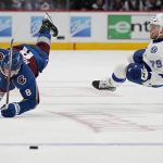
              Colorado Avalanche defenseman Cale Makar (8) and Tampa Bay Lightning center Ross Colton (79) collide during Game 2 of the NHL hockey Stanley Cup Final, Saturday, June 18, 2022, in Denver. (AP Photo/John Locher)
            