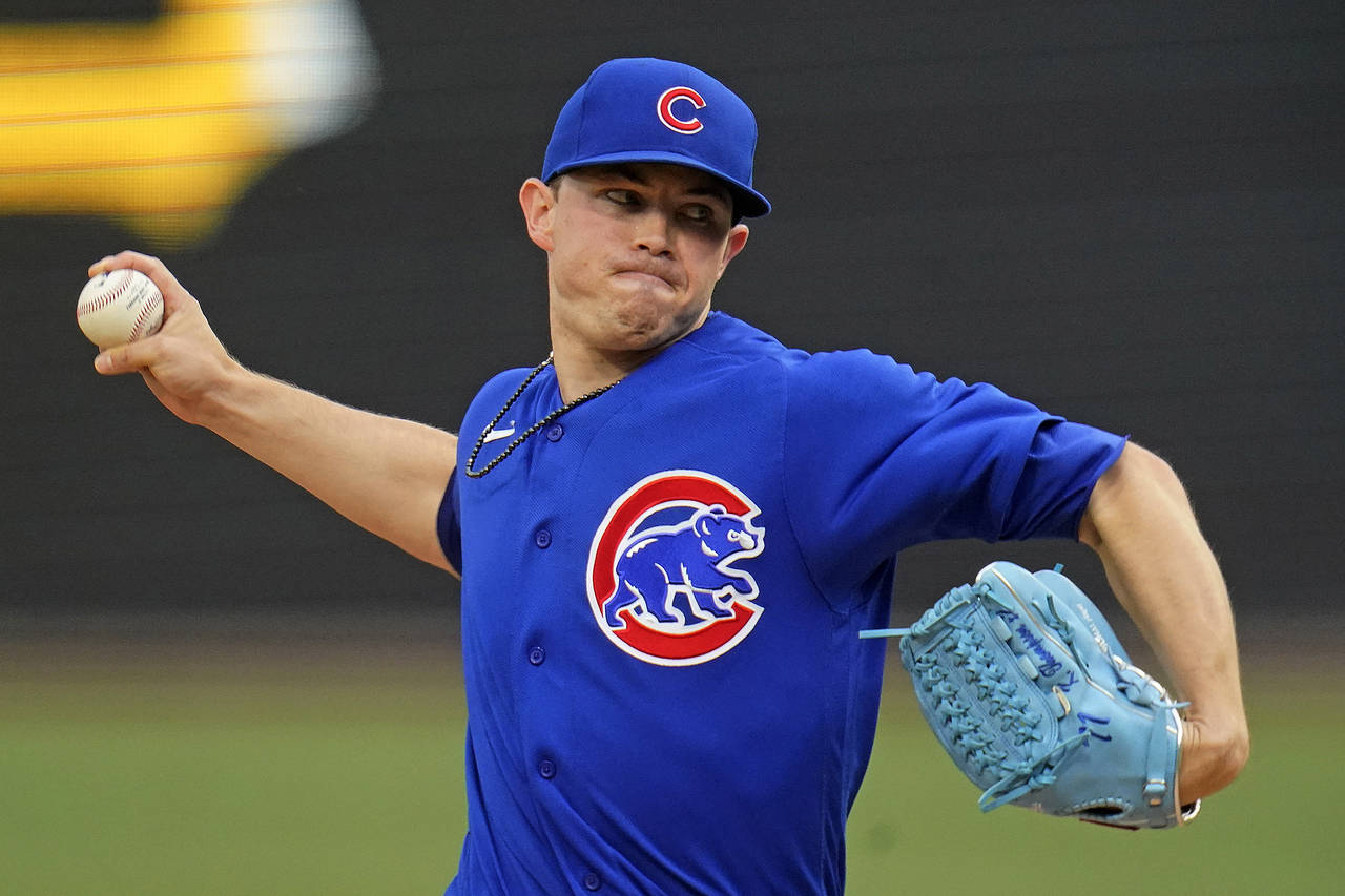 Chicago Cubs starting pitcher Keegan Thompson delivers during the first inning of a baseball game a...