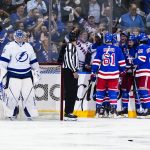
              Tampa Bay Lightning goaltender Andrei Vasilevskiy, left, looks down as the New York Rangers celebrate a goal by Chris Kreider during the first period in Game 1 of the NHL hockey Stanley Cup playoffs Eastern Conference finals Wednesday, June 1, 2022, in New York. (AP Photo/Frank Franklin II)
            
