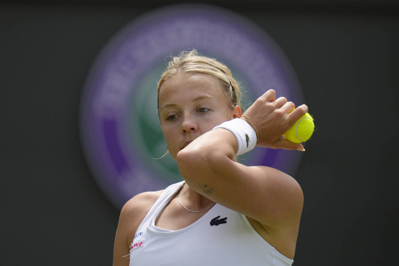 Estonia's Anett Kontaveit wipes her face after losing a point to Germany's Jule Niemeier during the...
