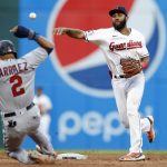 
              Cleveland Guardians shortstop Amed Rosario throws to first after forcing out Minnesota Twins' Luis Arraez (2) during the fifth inning in the second baseball game of a doubleheader, Tuesday, June 28, 2022, in Cleveland. Jorge Polanco was safe at first.  (AP Photo/Ron Schwane)
            
