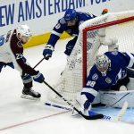 
              Tampa Bay Lightning goaltender Andrei Vasilevskiy (88) stops a shot by Colorado Avalanche center Nathan MacKinnon (29) during the second period of Game 6 of the NHL hockey Stanley Cup Finals on Sunday, June 26, 2022, in Tampa, Fla. (AP Photo/John Bazemore)
            
