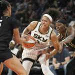 
              Chicago Sky forward Candace Parker, center, battles for the ball with Las Vegas Aces forward Dearica Hamby (5) and guard Chelsea Gray, right, during the first half of a WNBA basketball game Tuesday, June 21, 2022, in Las Vegas. (AP Photo/John Locher)
            