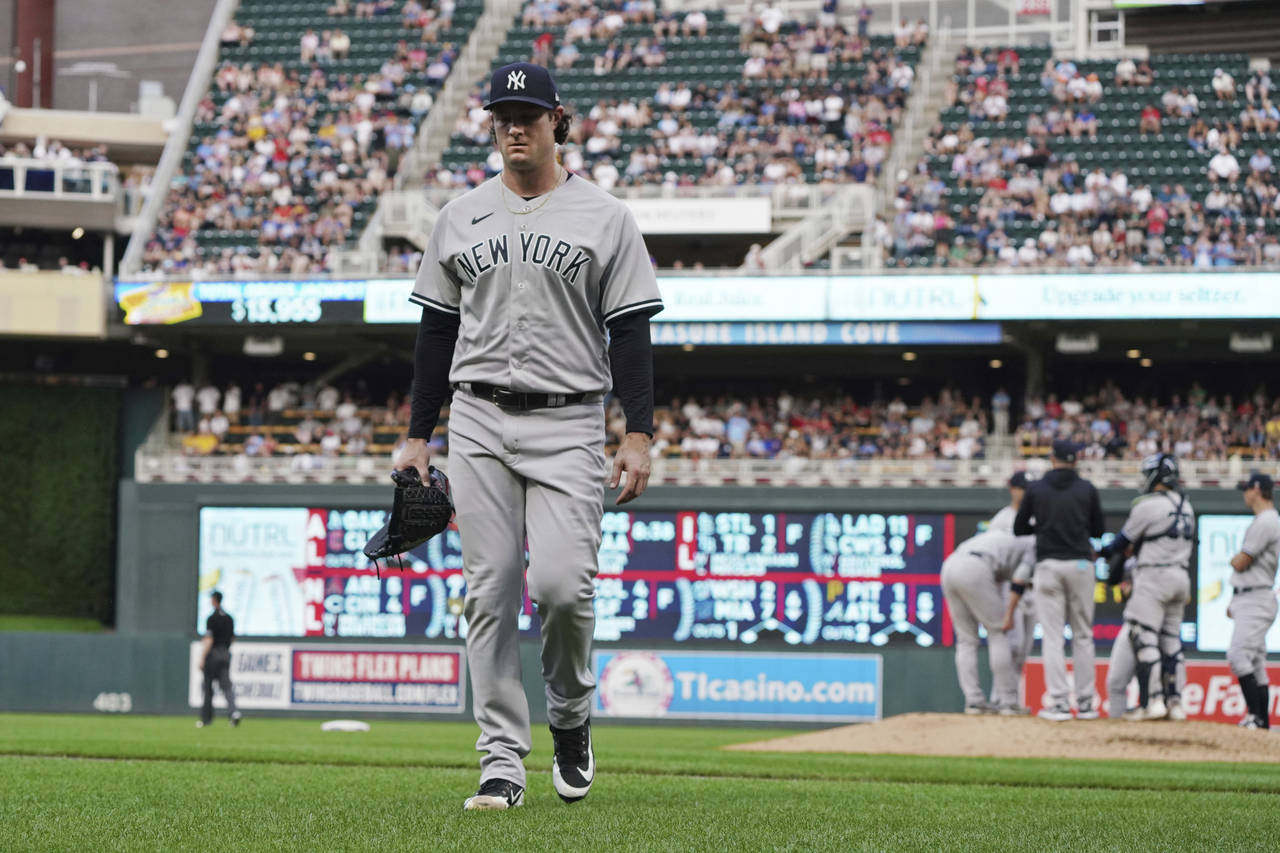 New York Yankees pitcher Gerrit Cole heads to the dugout after he was pulled during the third innin...