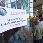 
              A sign hangs next to the entryway to advise fans that some merchandise is already out of stock at the team store in Ball Arena, Monday, June 27, 2022, in Denver after the Colorado Avalanche defeated the Tampa Bay Lightning in Game 6 of the Stanley Cup Final to claim the NHL hockey championship. (AP Photo/David Zalubowski)
            