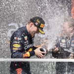 
              Red Bull driver Max Verstappen, of the Netherlands, is sprayed with champagne by a member of his team after winning the Canadian Grand Prix in Montreal on Sunday, June 19, 2022. (Paul Chiasson/The Canadian Press via AP)
            