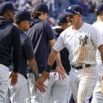 
              New York Yankees' Matt Carpenter, right, celebrates with teammates after they defeated the Chicago Cubs in a baseball game, Sunday, June 12, 2022, in New York. (AP Photo/Mary Altaffer)
            