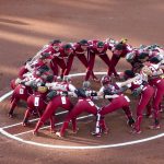 
              Oklahoma players gather at the pitcher's circle before the opening game of the NCAA Women's College World Series finals in Oklahoma City on Wednesday, June 8, 2022. (Ian Maule/Tulsa World via AP)
            