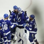 
              Tampa Bay Lightning goaltender Andrei Vasilevskiy, center, celebrates with teammates after Game 3 of the NHL hockey Stanley Cup Final against Colorado Avalanche on Monday, June 20, 2022, in Tampa, Fla. (AP Photo/Chris O'Meara)
            