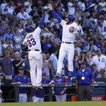 
              Chicago Cubs' Patrick Wisdom, right, celebrates his grand slam against the Cincinnati Reds with third base coach Willie Harris during the second inning of a baseball game Thursday, June 30, 2022, in Chicago. (AP Photo/Charles Rex Arbogast)
            